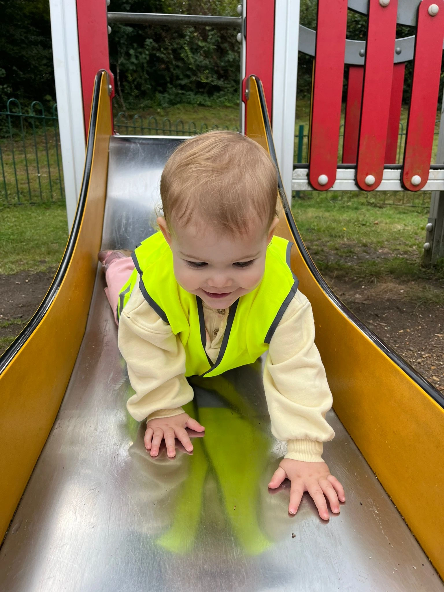 Image of a child on a slide.